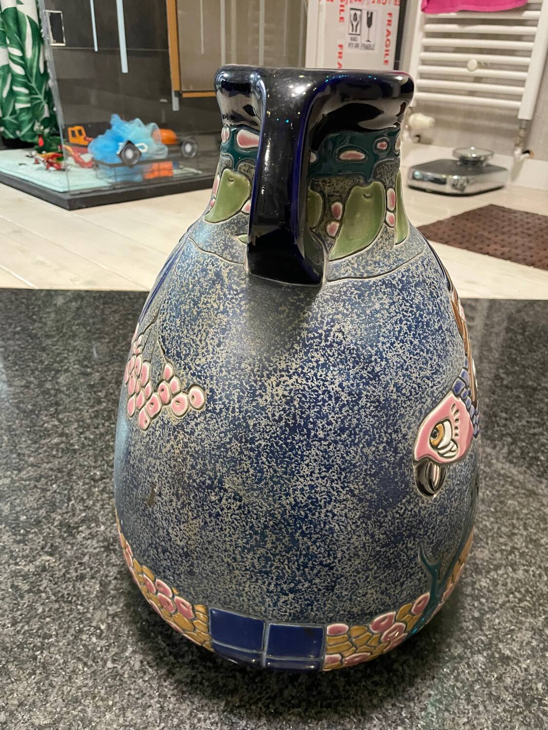 Large relief vase with parrot design