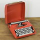 Hermès Baby orange typewriter.