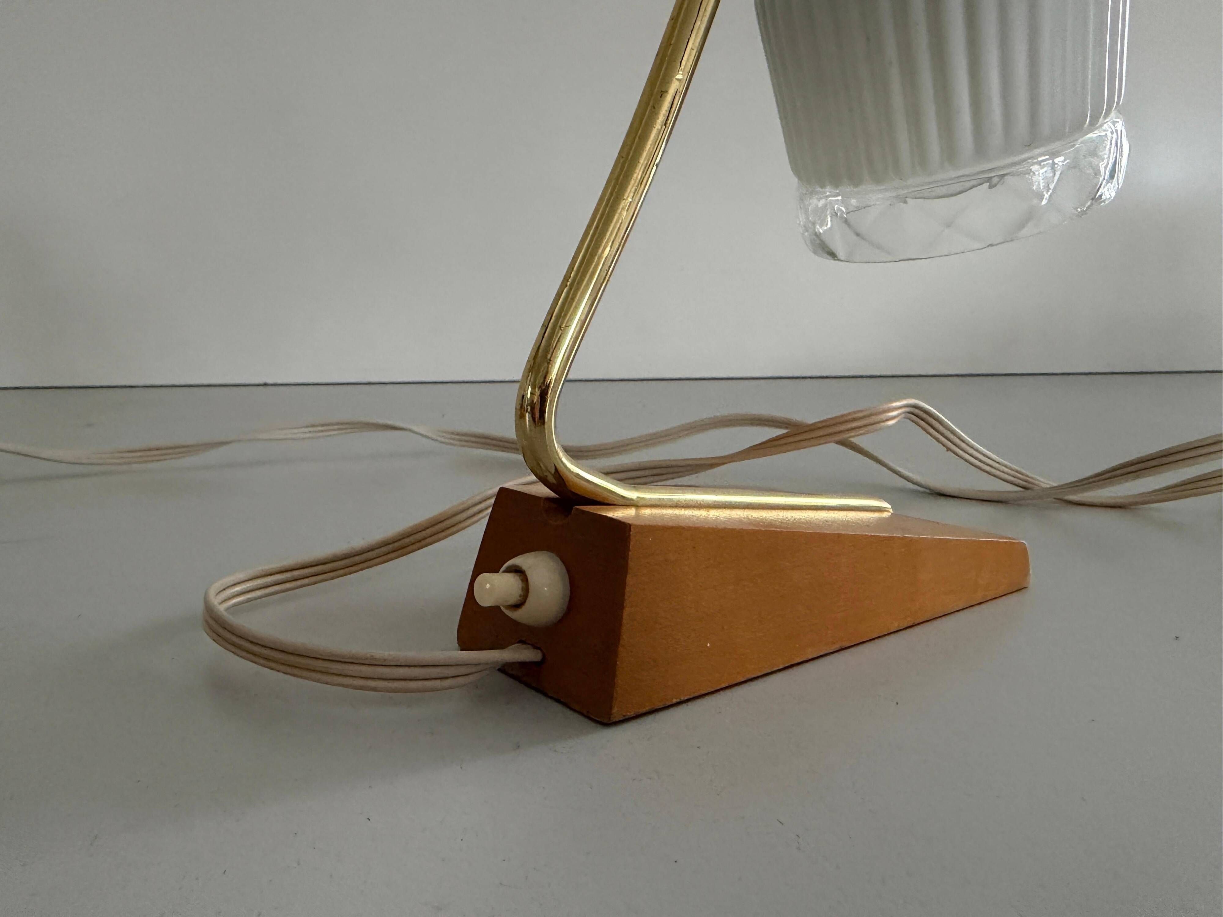 Pair of bedside lamps in brass and wood from the mid-century, 1960, Germany.