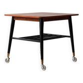 Table basse scandinave vintage en teck à roulettes