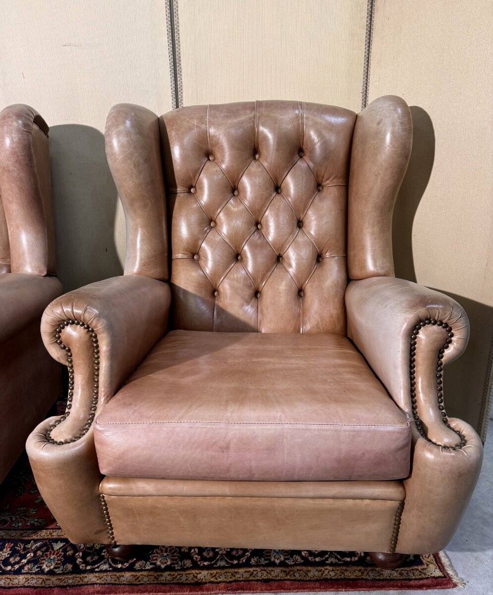 Pair of Chesterfield leather wingback armchairs