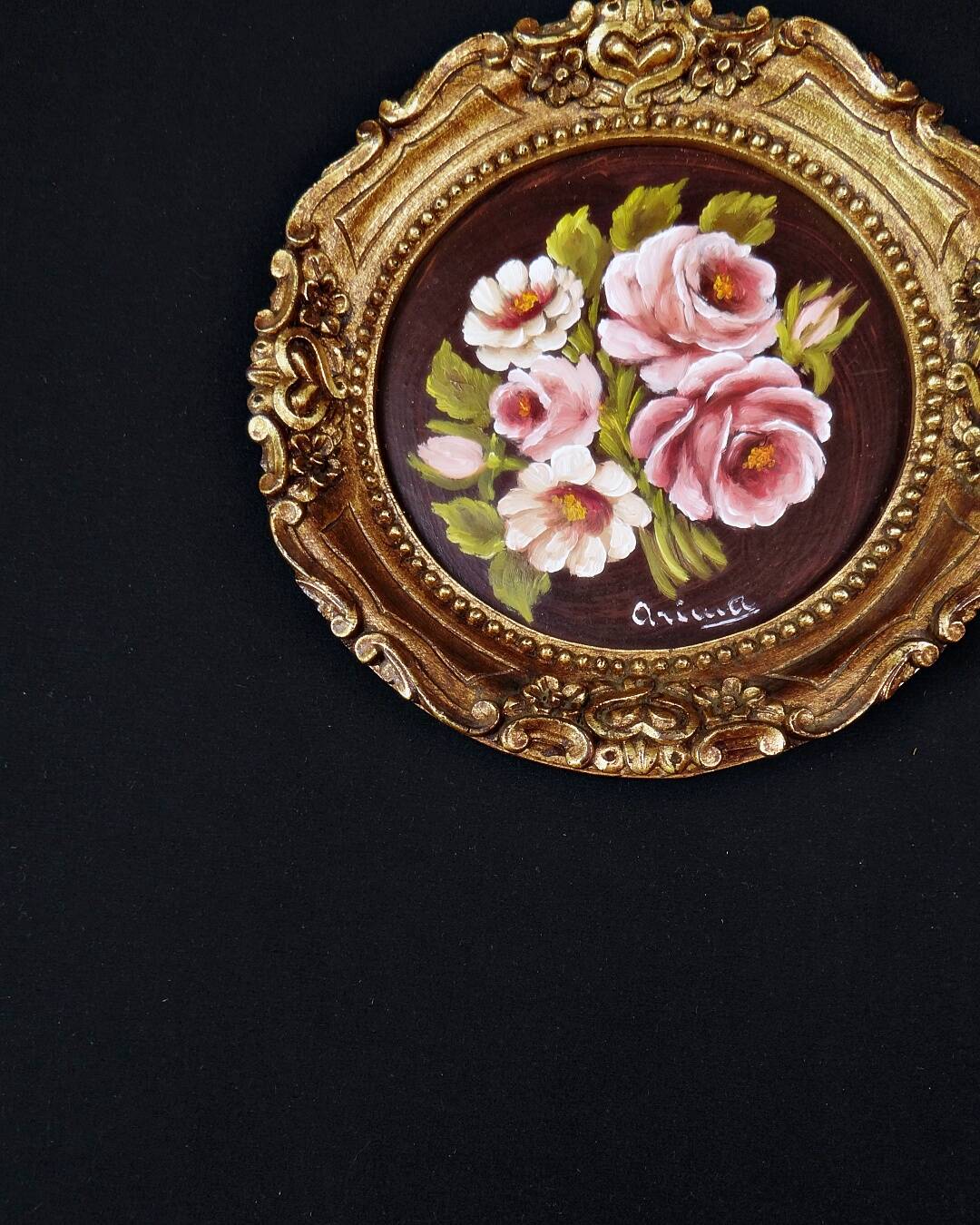 Still life in Tondo oil on panel of a bouquet of pink roses signed