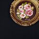 Still life in Tondo oil on panel of a bouquet of pink roses signed