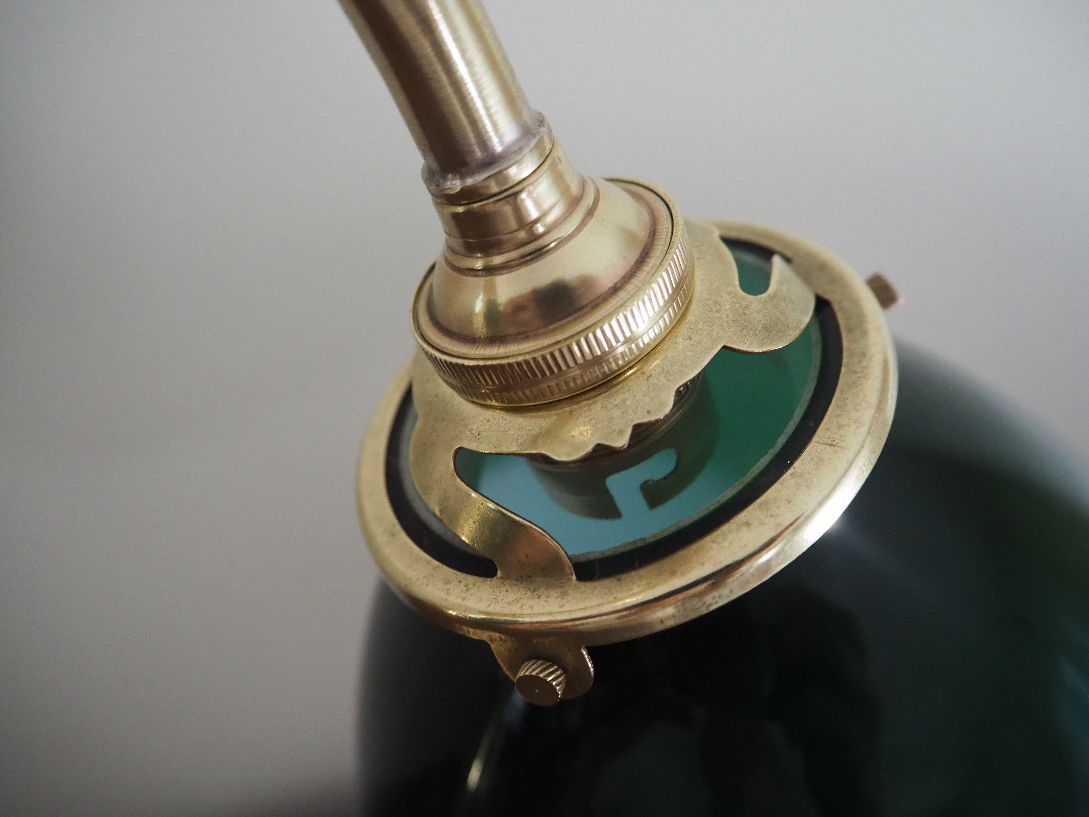 Desk lamp in brass with a swan neck and green opaline glass.
