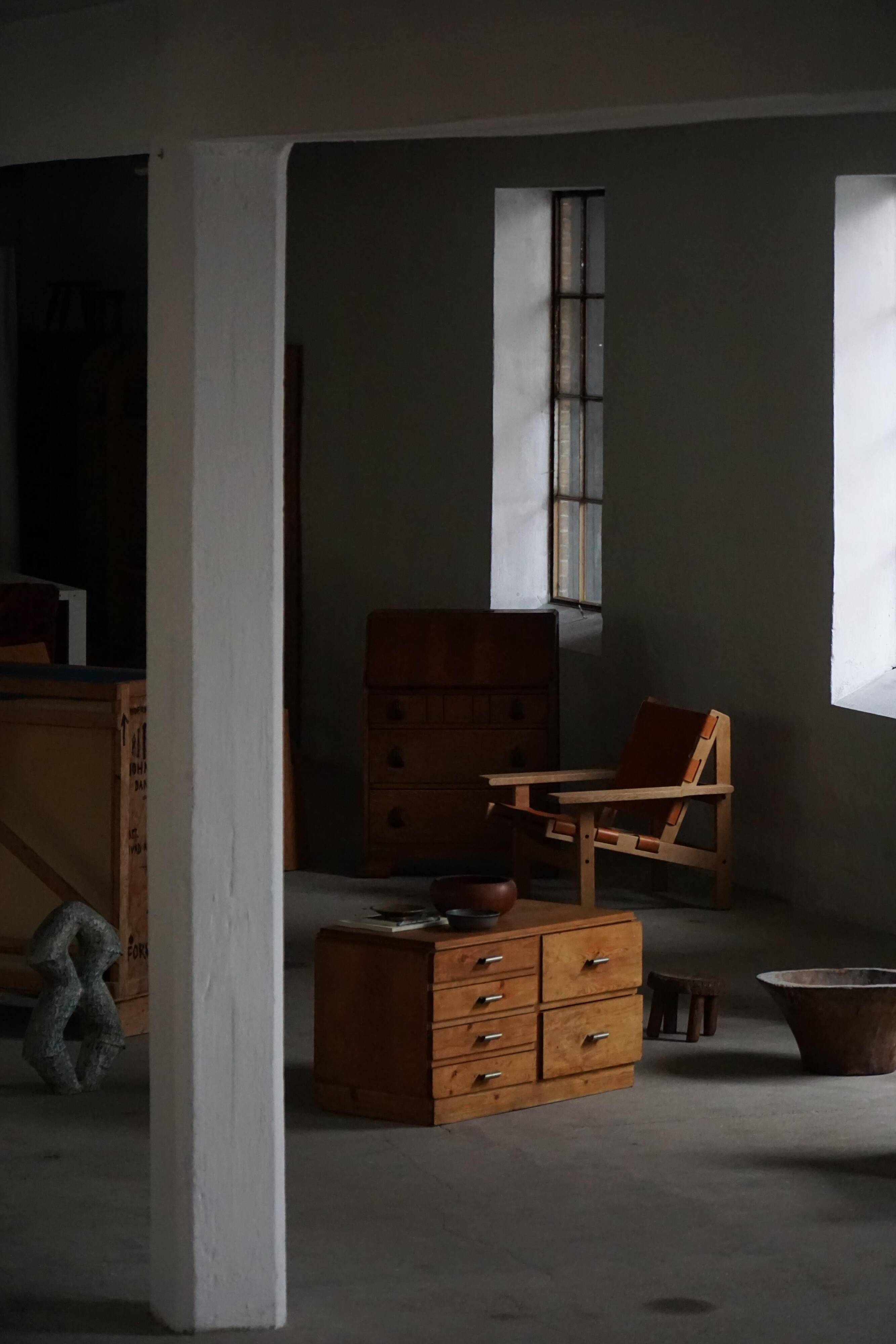 Mid-20th century Art Deco chest of drawers in pine with metal handles, 1940s.