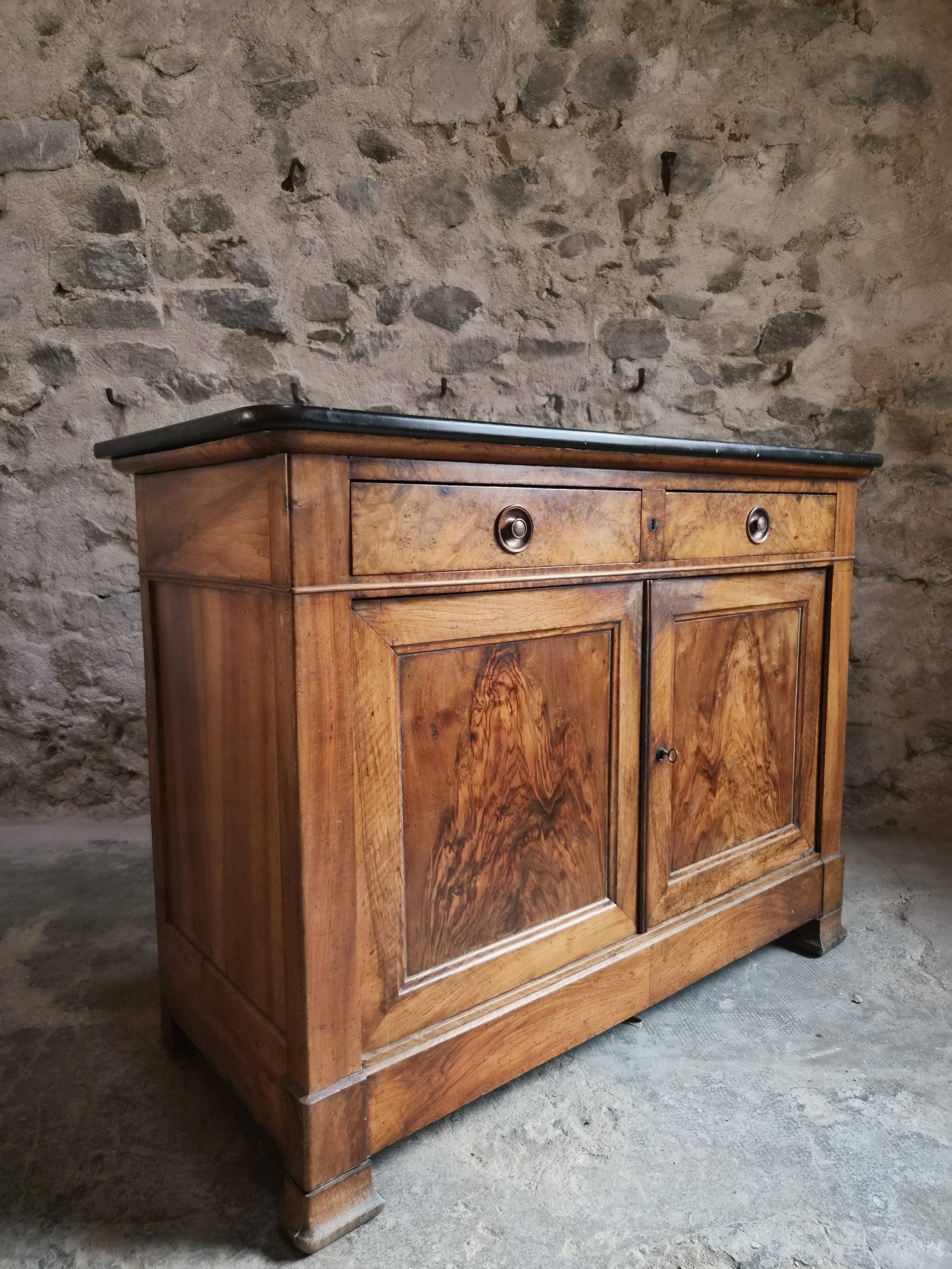 French Louis Philippe walnut buffet with black marble top, France, circa 1840–1860.