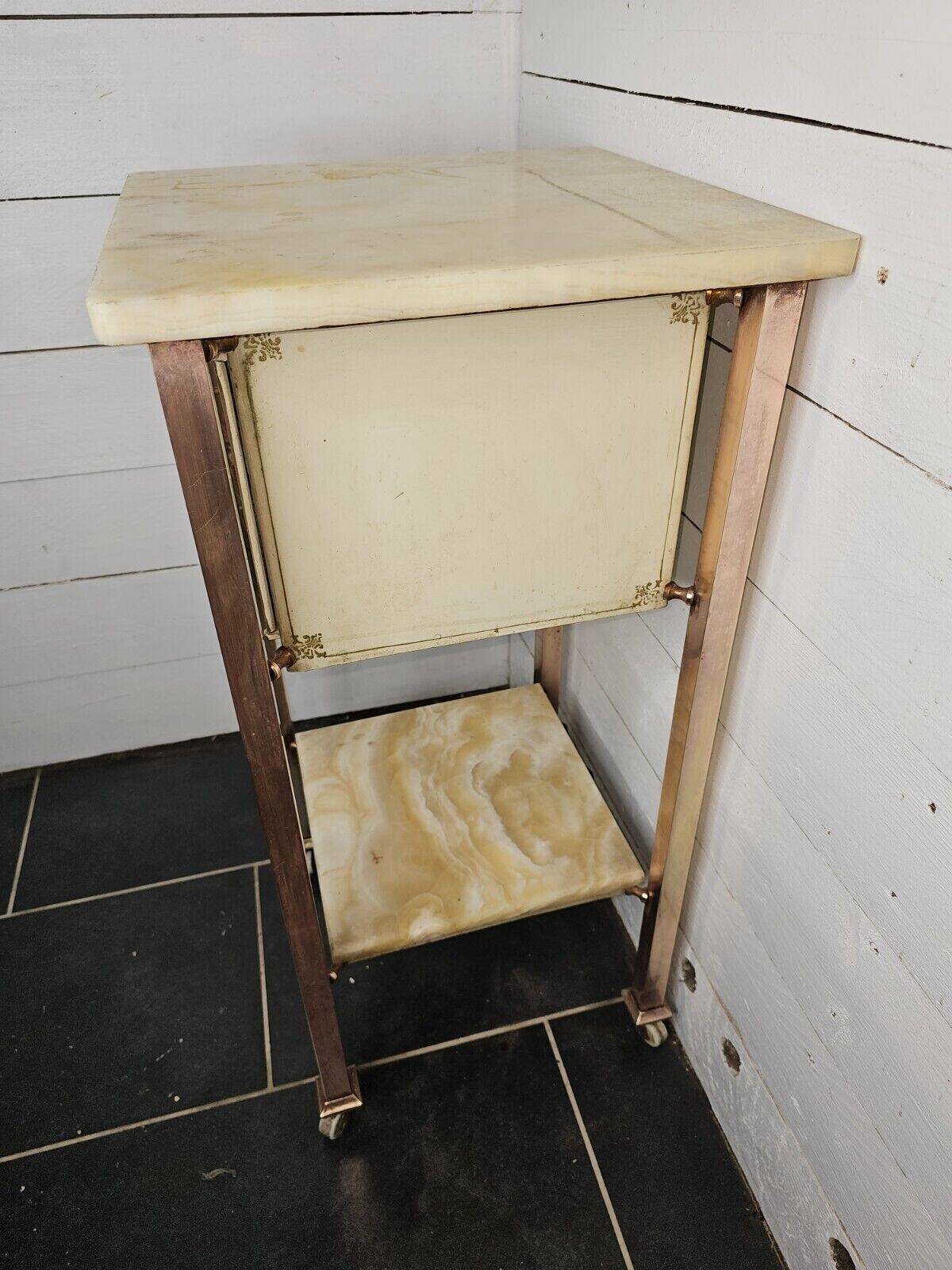 Bedside table in patinated iron, brass and marble tops