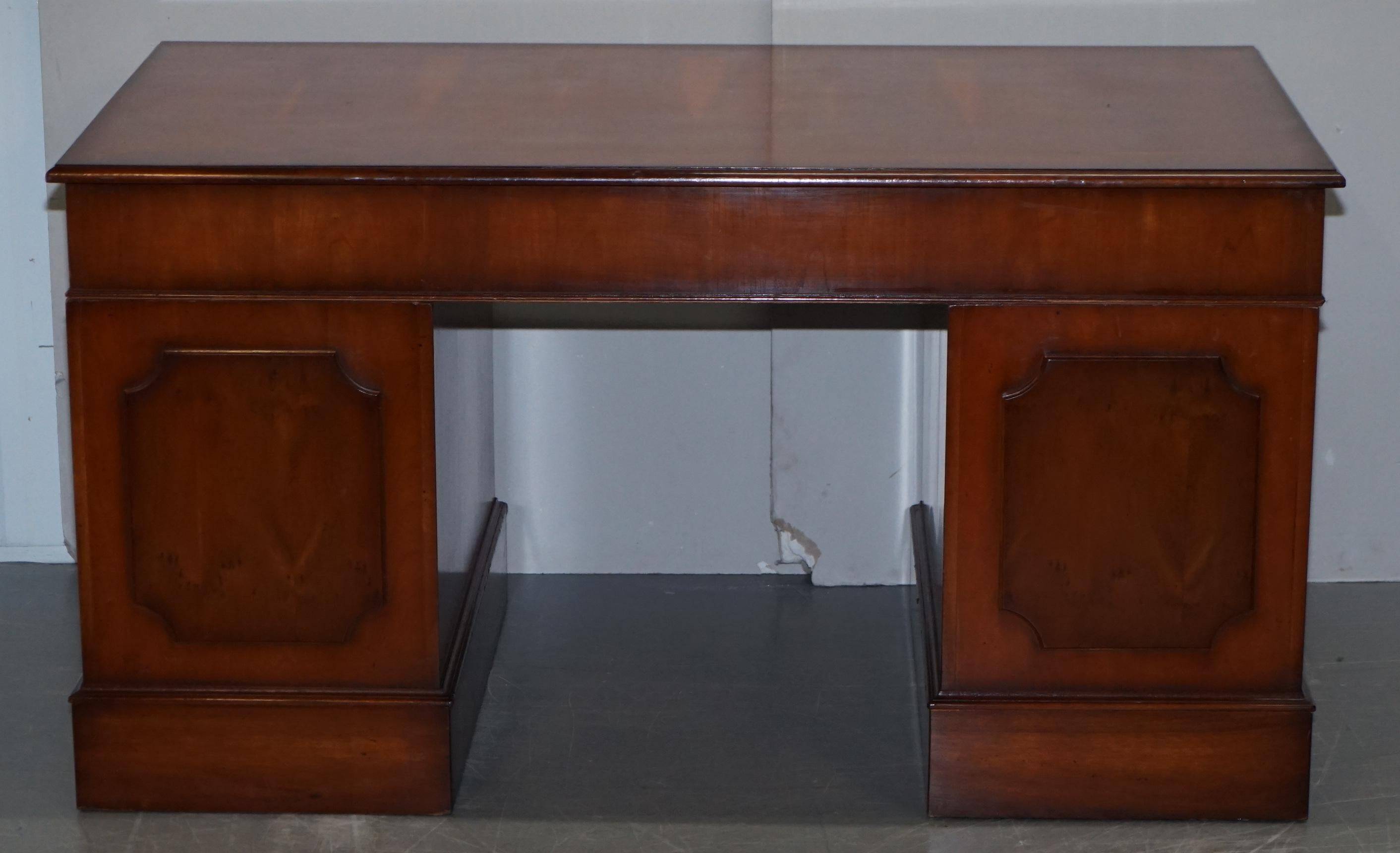 Partner desk with double pedestal in burr yew wood with decorated top.