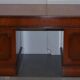 Partner desk with double pedestal in burr yew wood with decorated top.