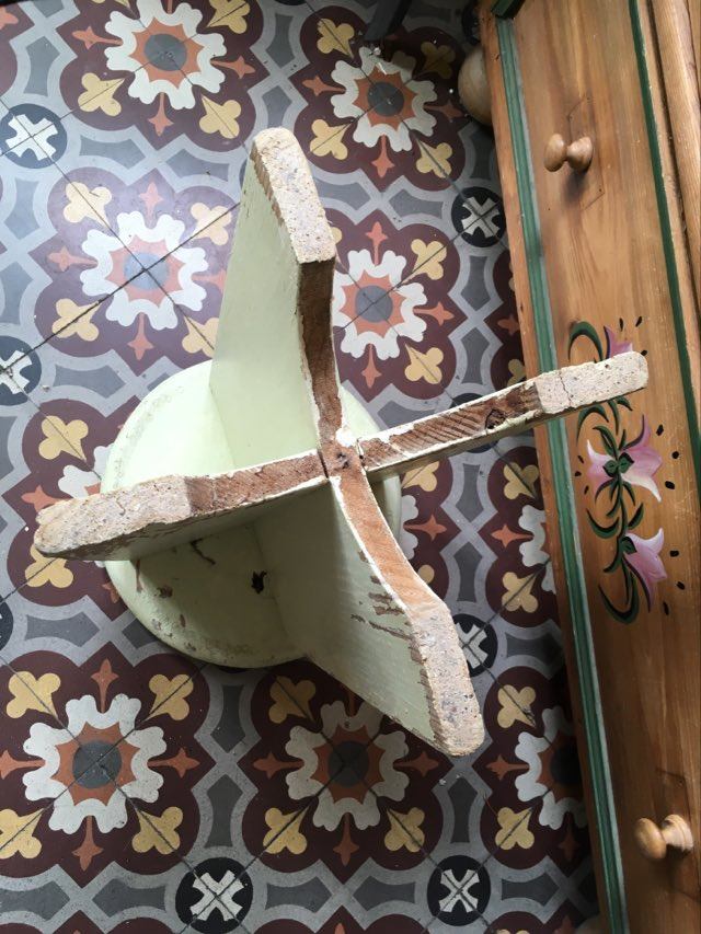 A rough wooden stool patinated by time