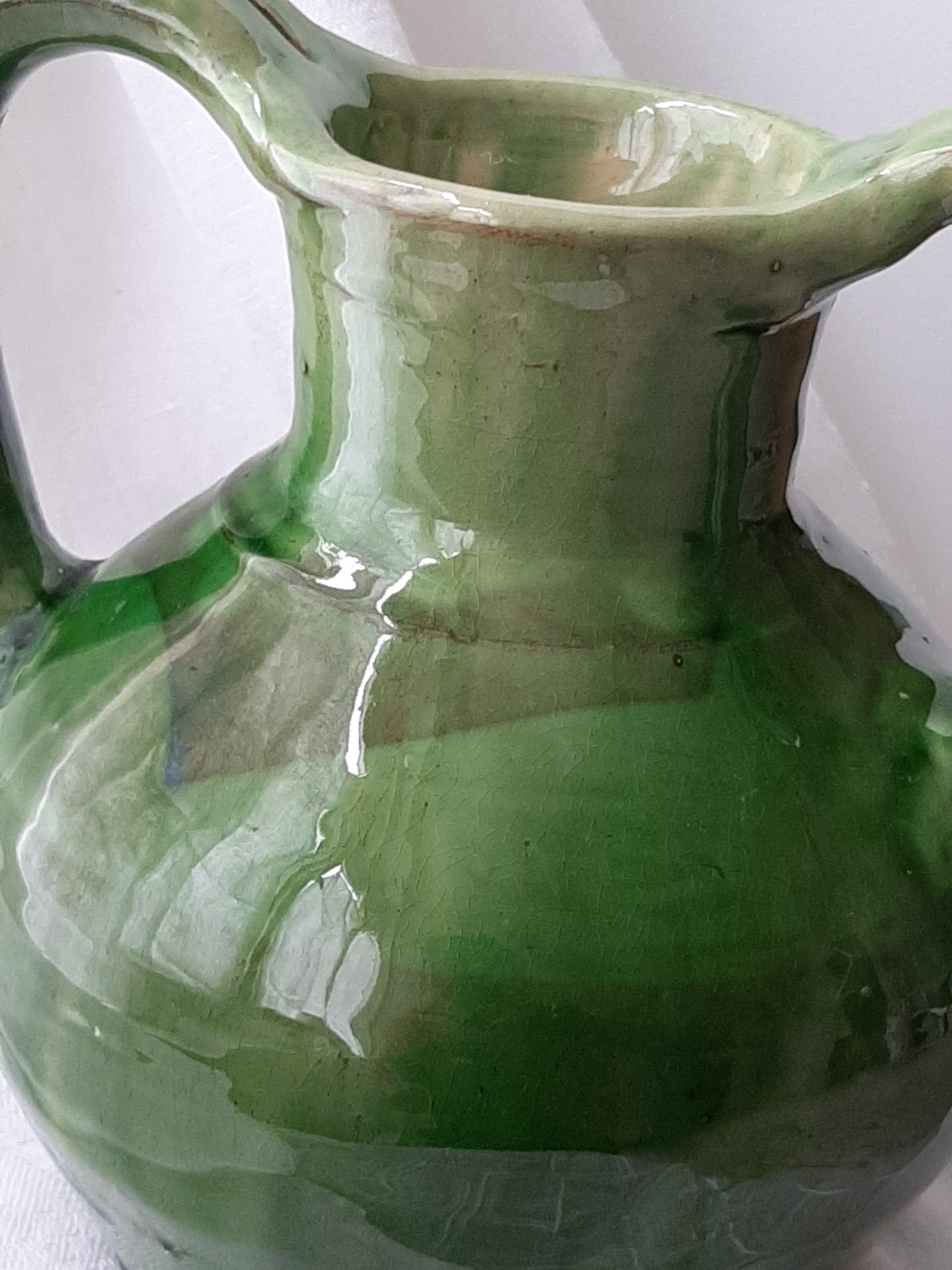Old glazed terracotta pitcher