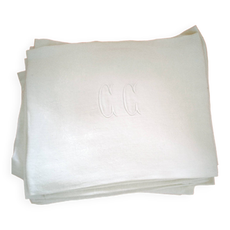 12 Damask napkins with lettering.