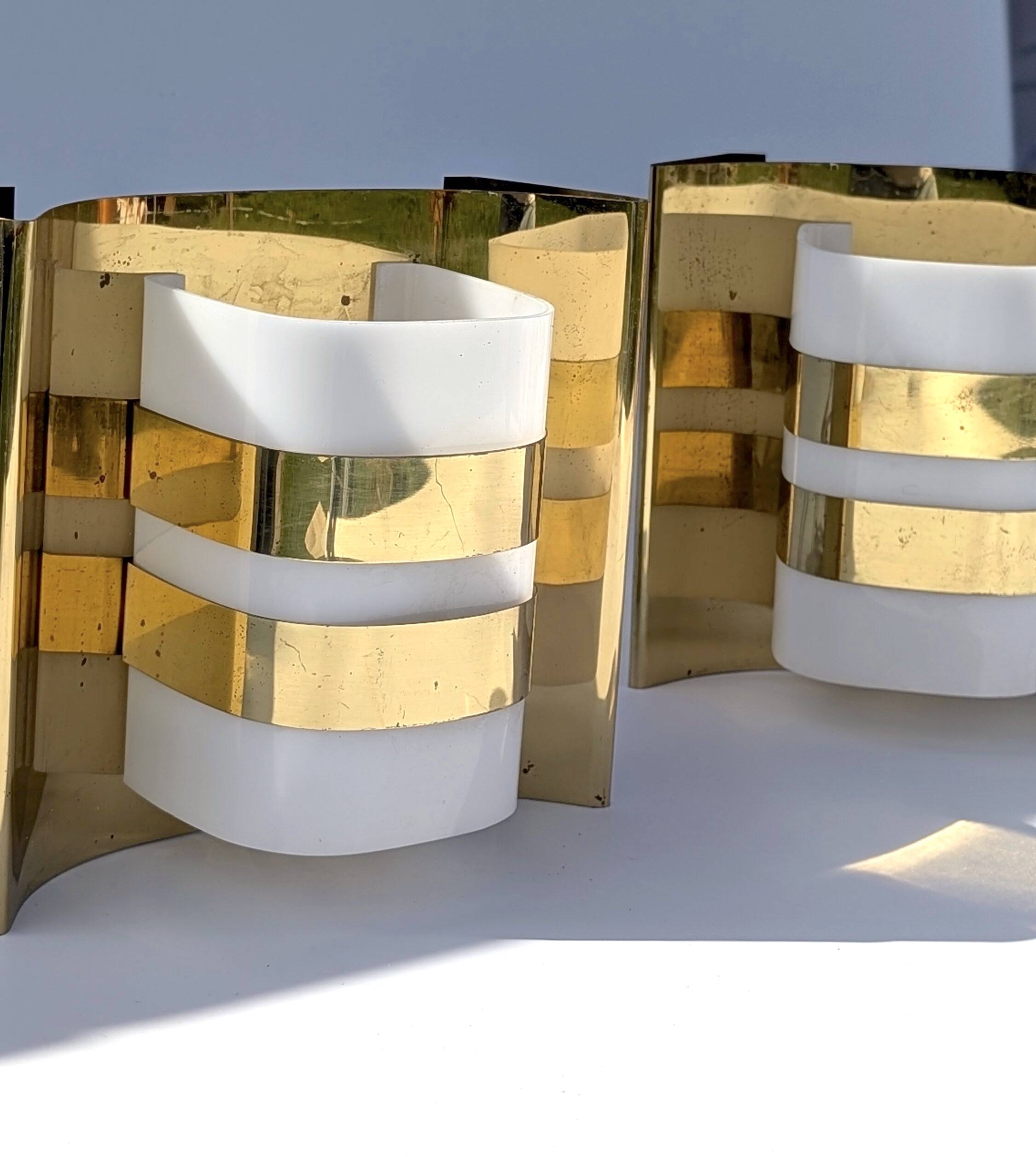 Pair of Hans-Agne Jakobsson V334/1 wall lamps in brass and opaline plastic