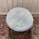 Table basse ovale de style Louis XVIen laiton et marbre