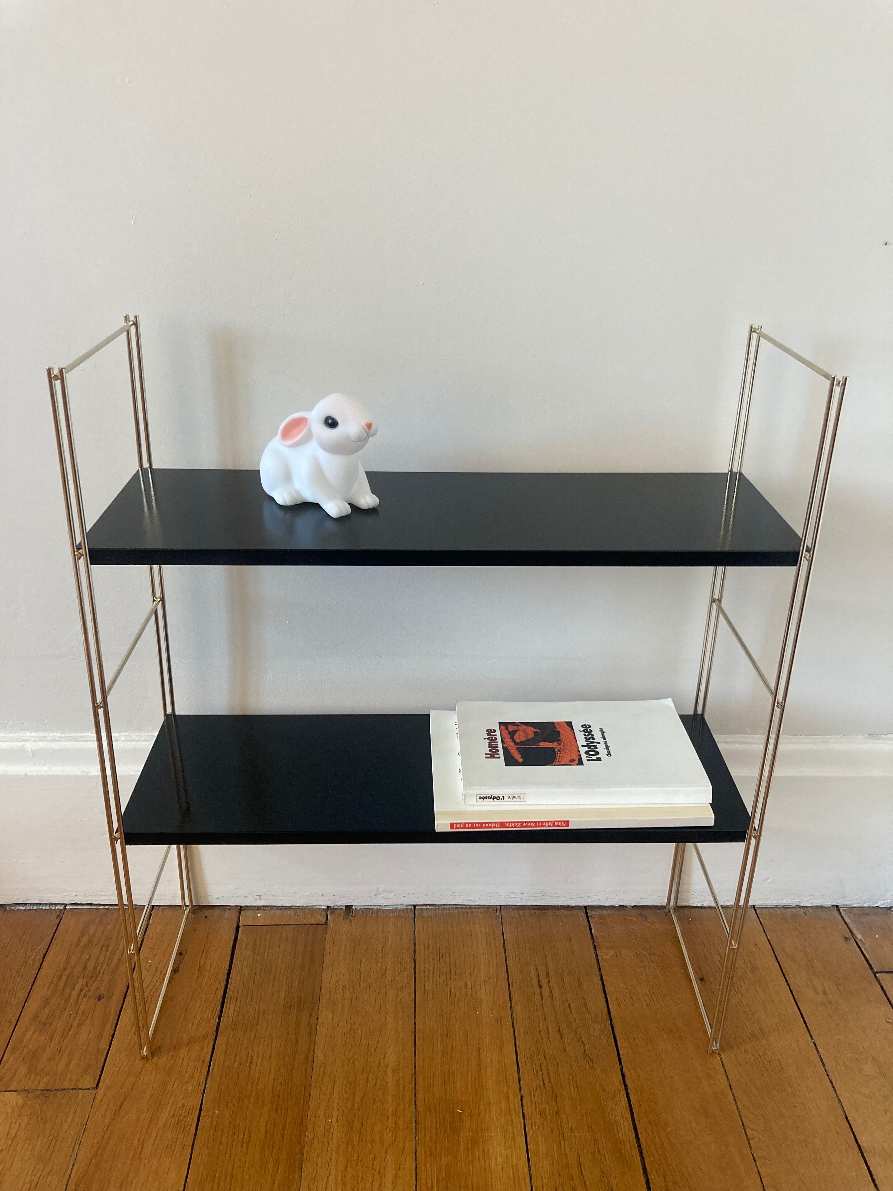 Black and gold string shelf