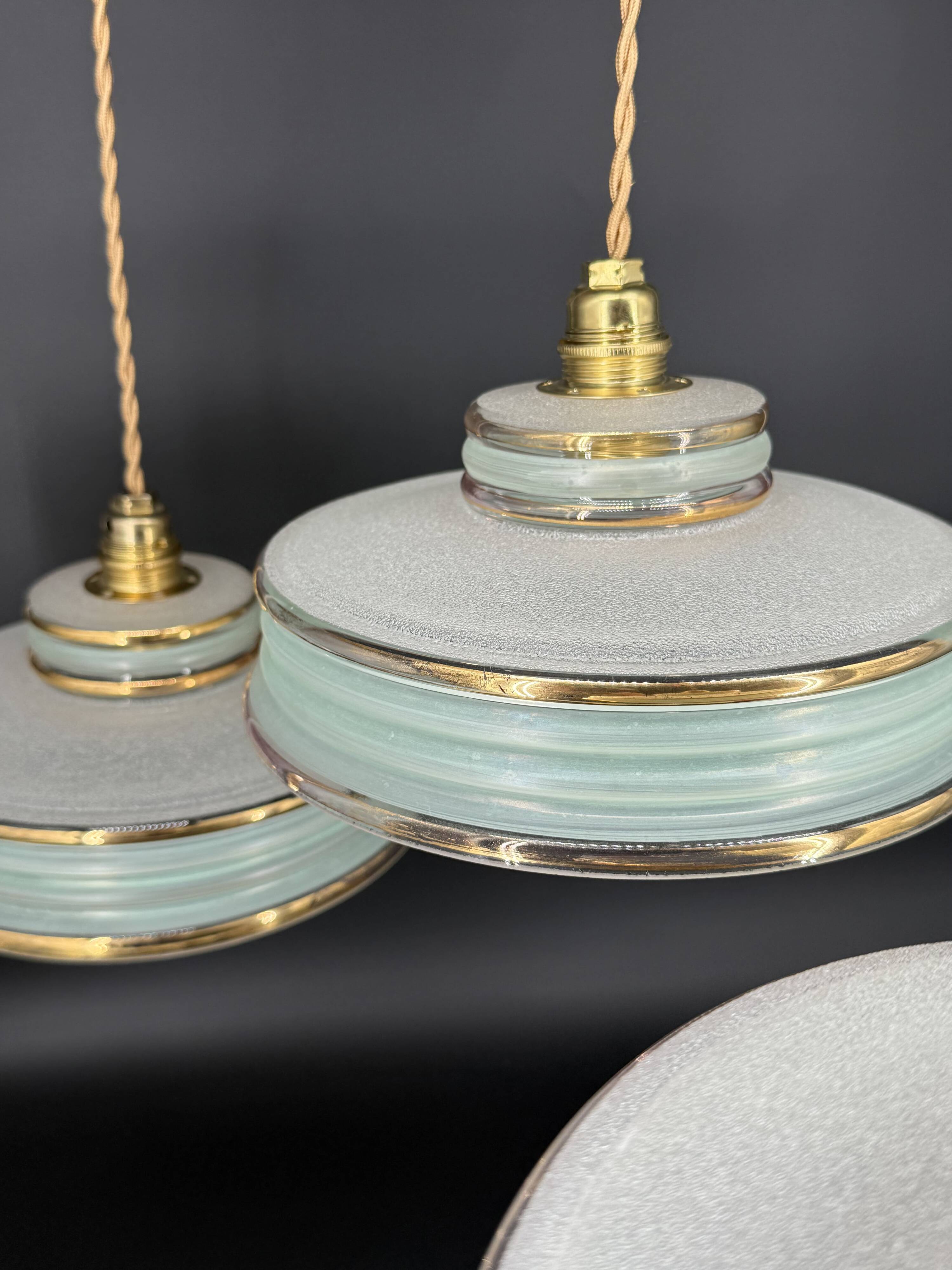 Set of 4 Art Deco pendant lights in frosted water green and gold.