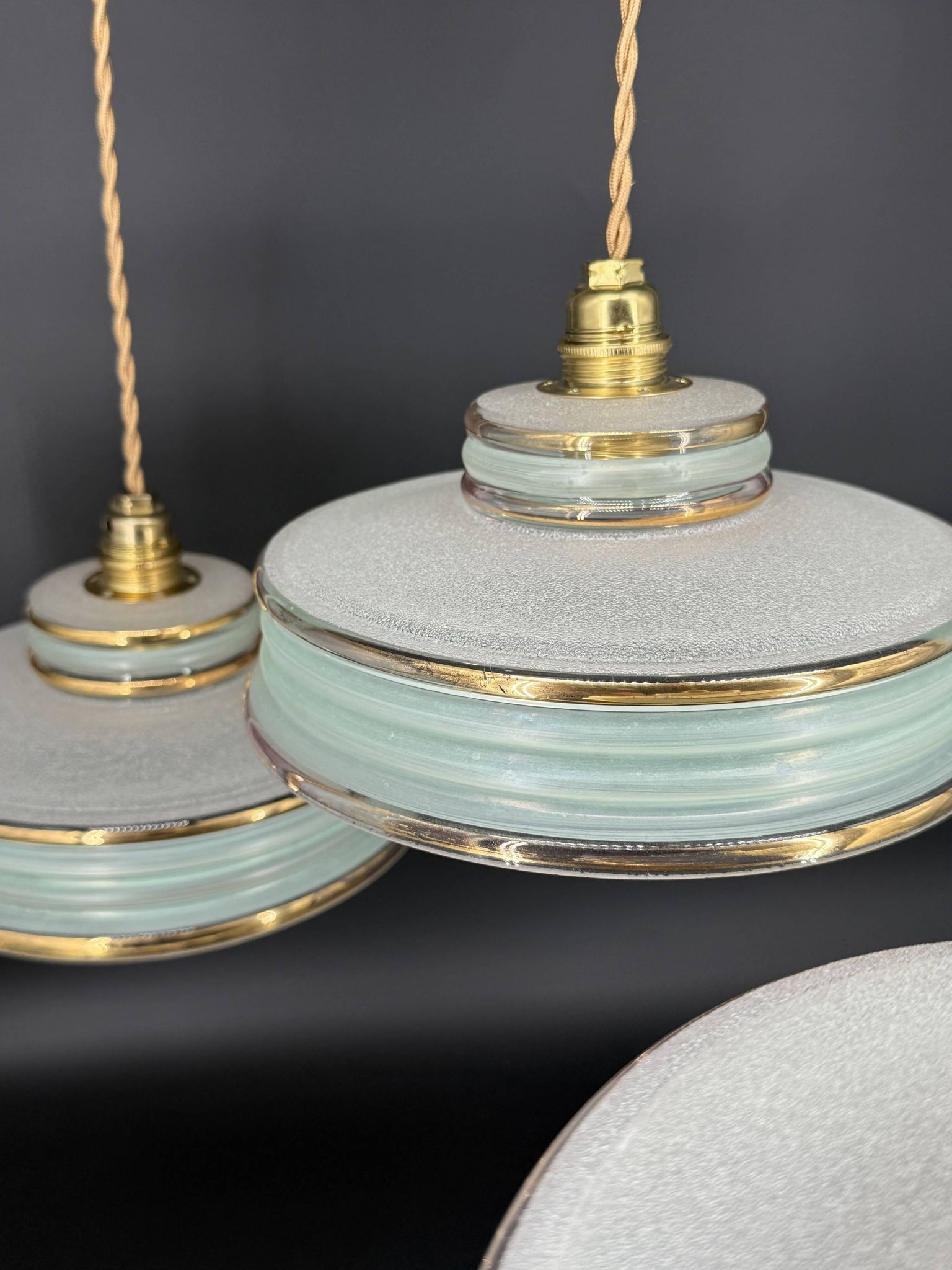 Set of 4 Art Deco pendant lights in frosted water green and gold.