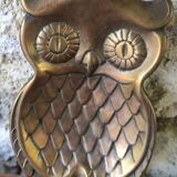 empty brass owl pocket