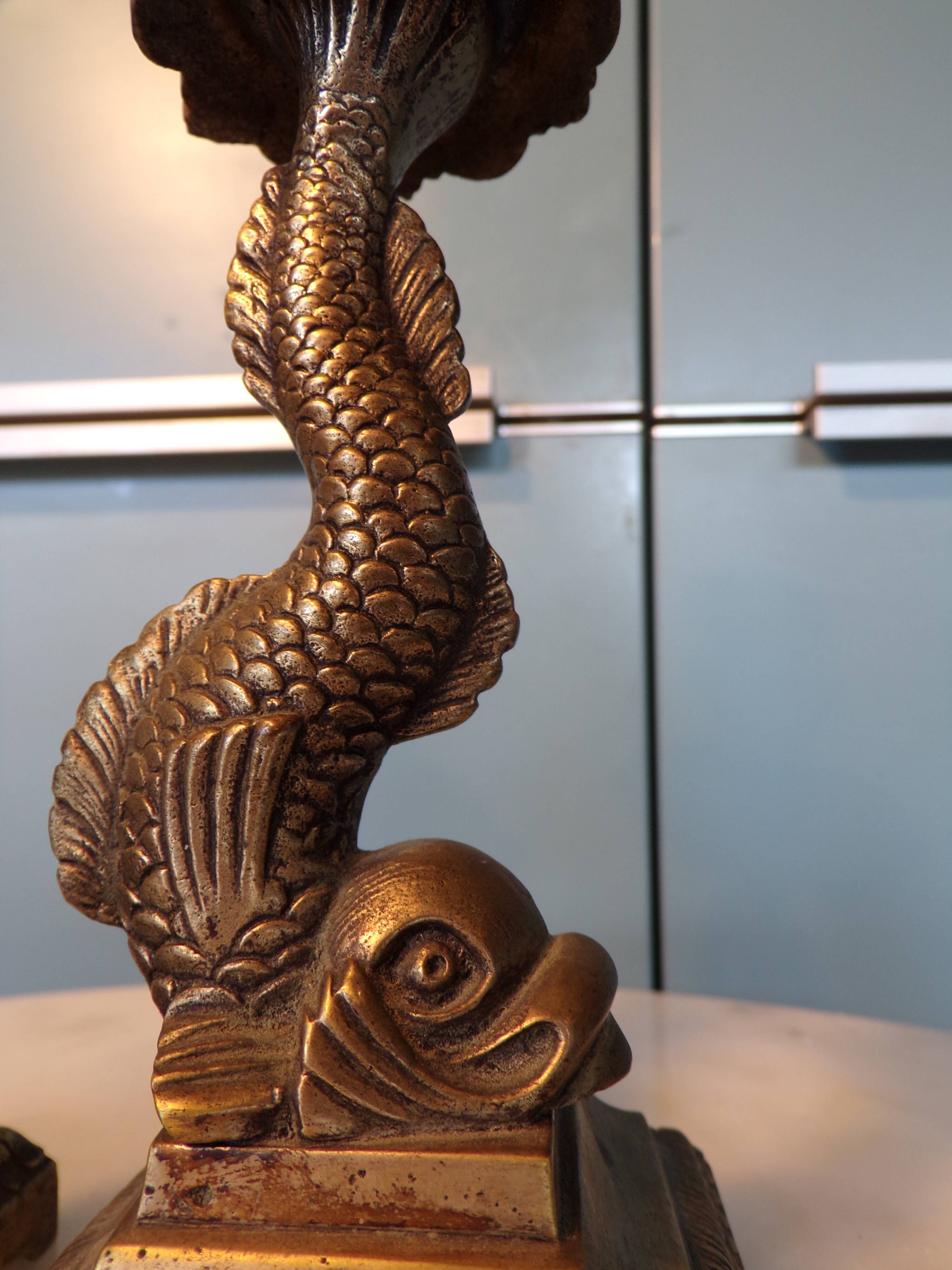 Pair of bronze dolphin candlesticks