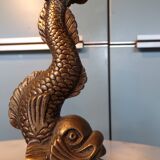 Pair of bronze dolphin candlesticks