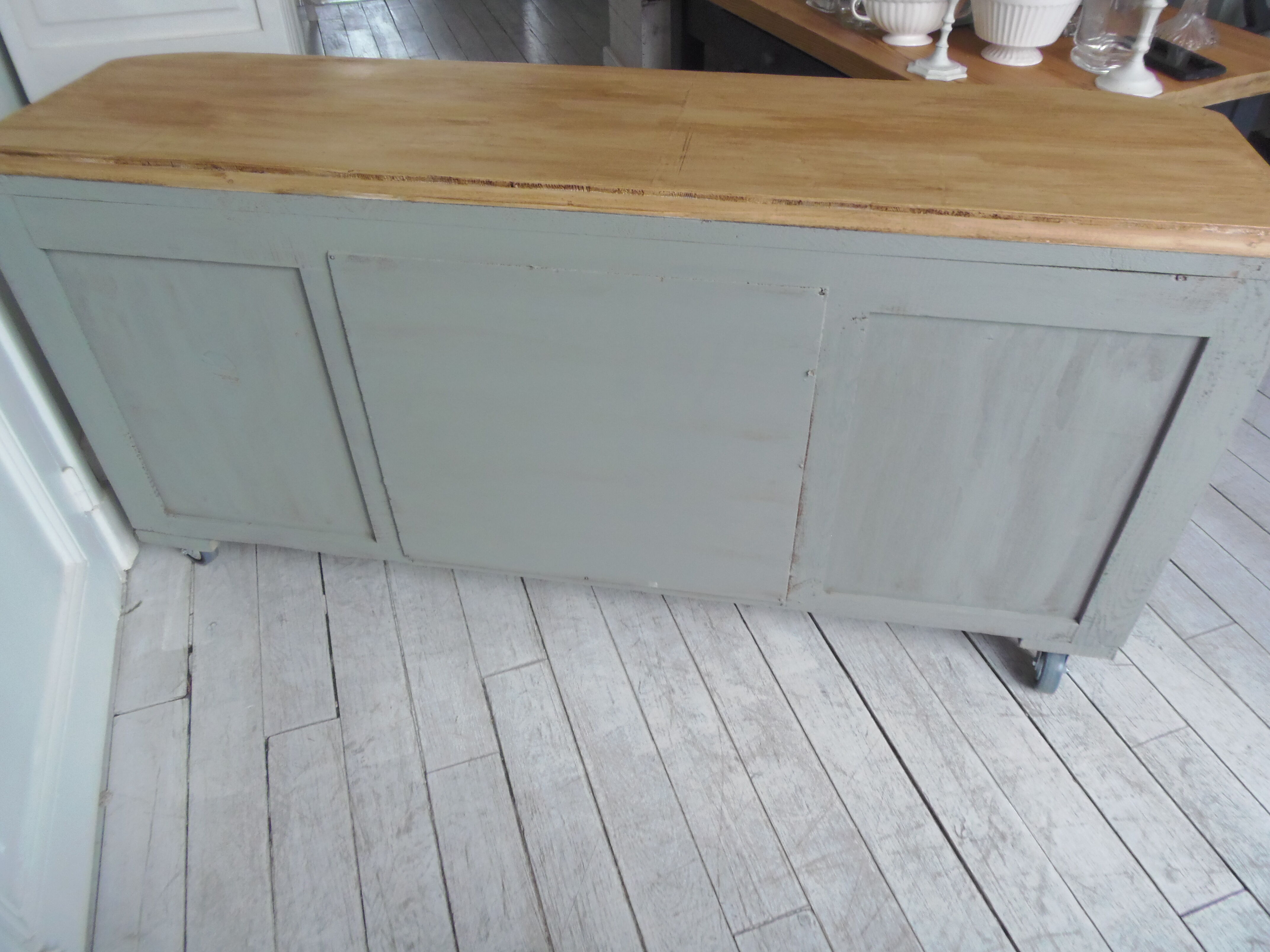 Art Deco furniture revisited in gray green and placed on wheels.