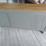 Art Deco furniture revisited in gray green and placed on wheels.