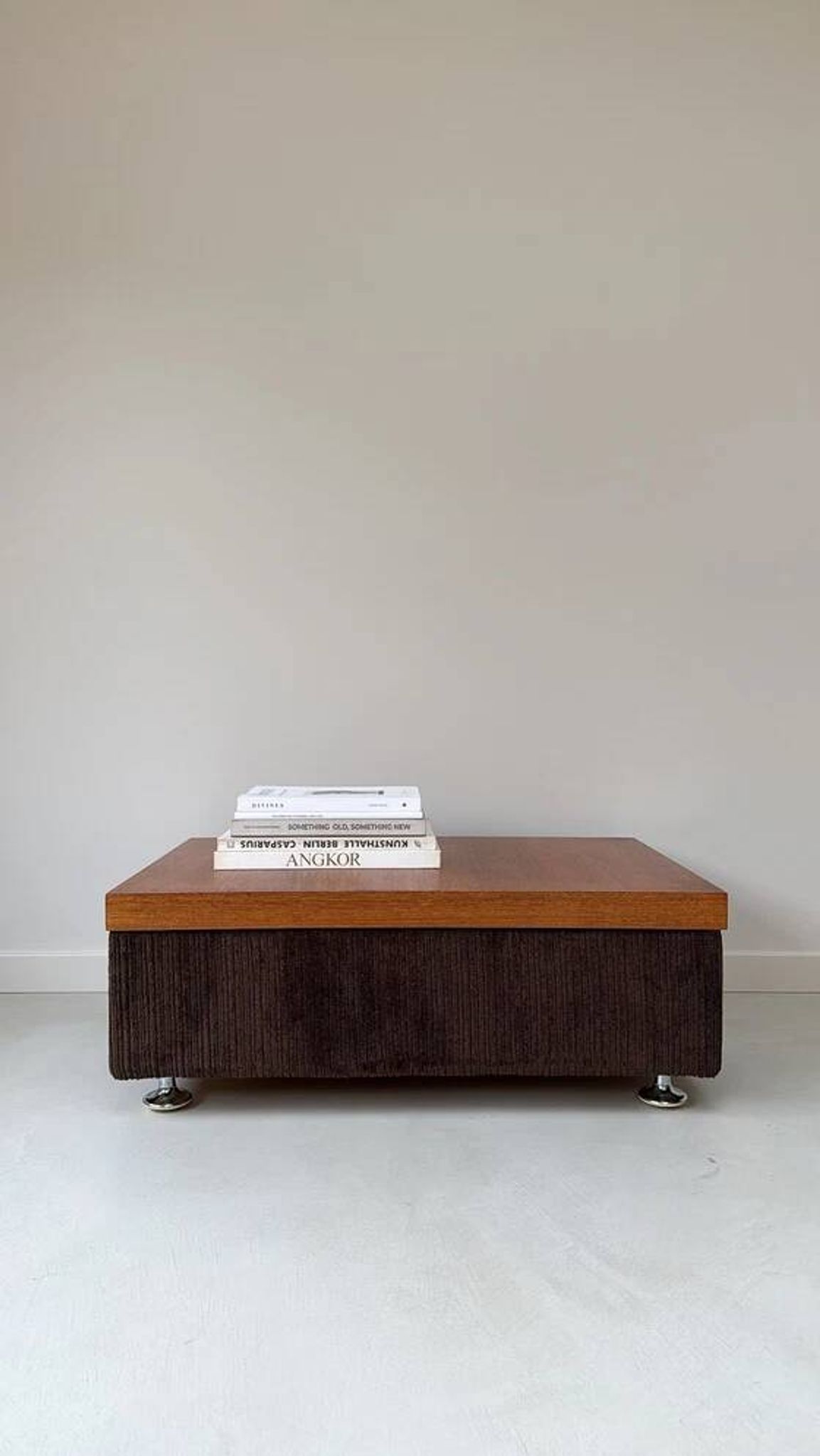 Coffee table with brown corduroy fabric, wooden top and chrome legs