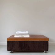 Coffee table with brown corduroy fabric, wooden top and chrome legs