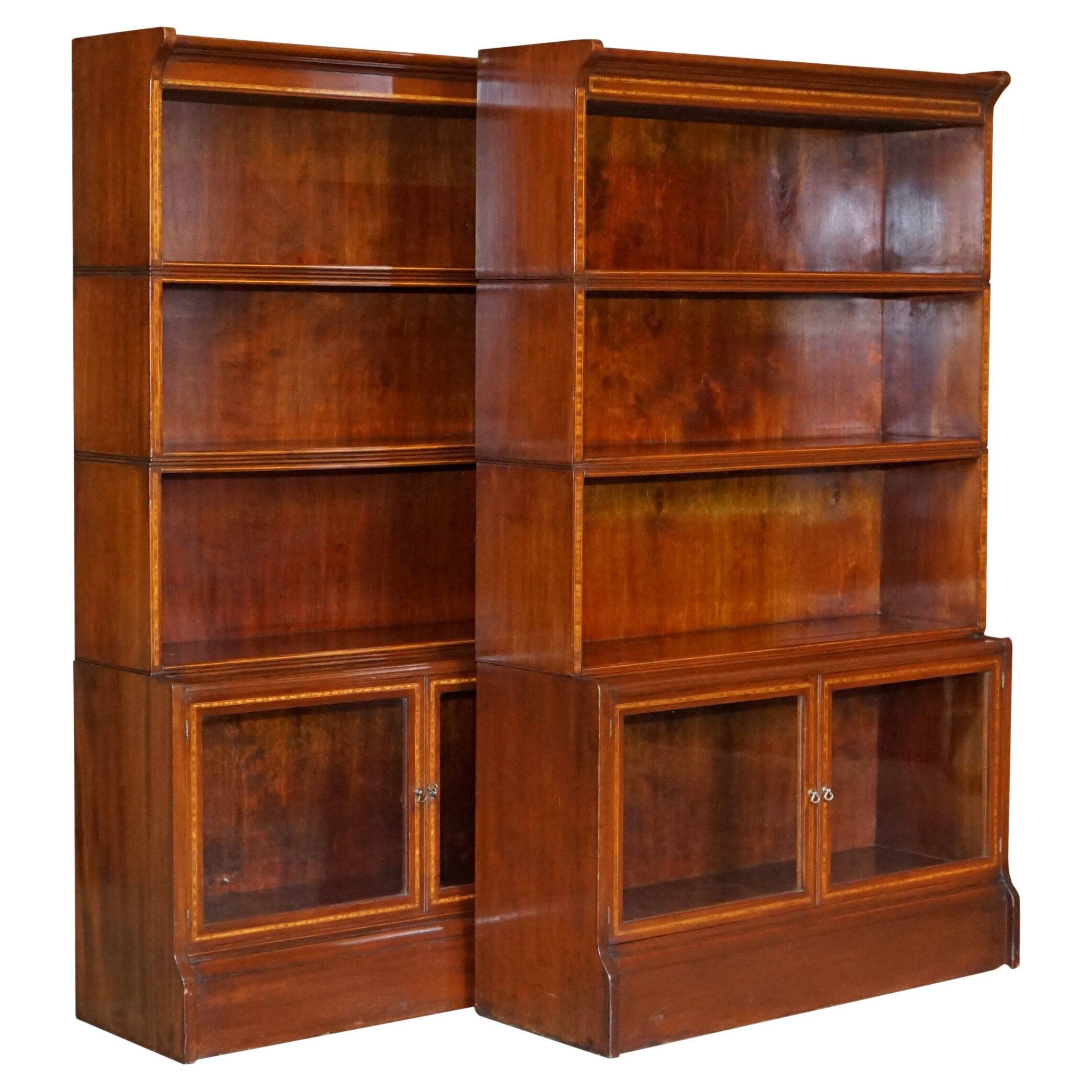 Antique pair of legal bookcases by William Baker Co in hardwood, satin and walnut.