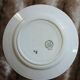 13 mismatched flat plates in ironstone