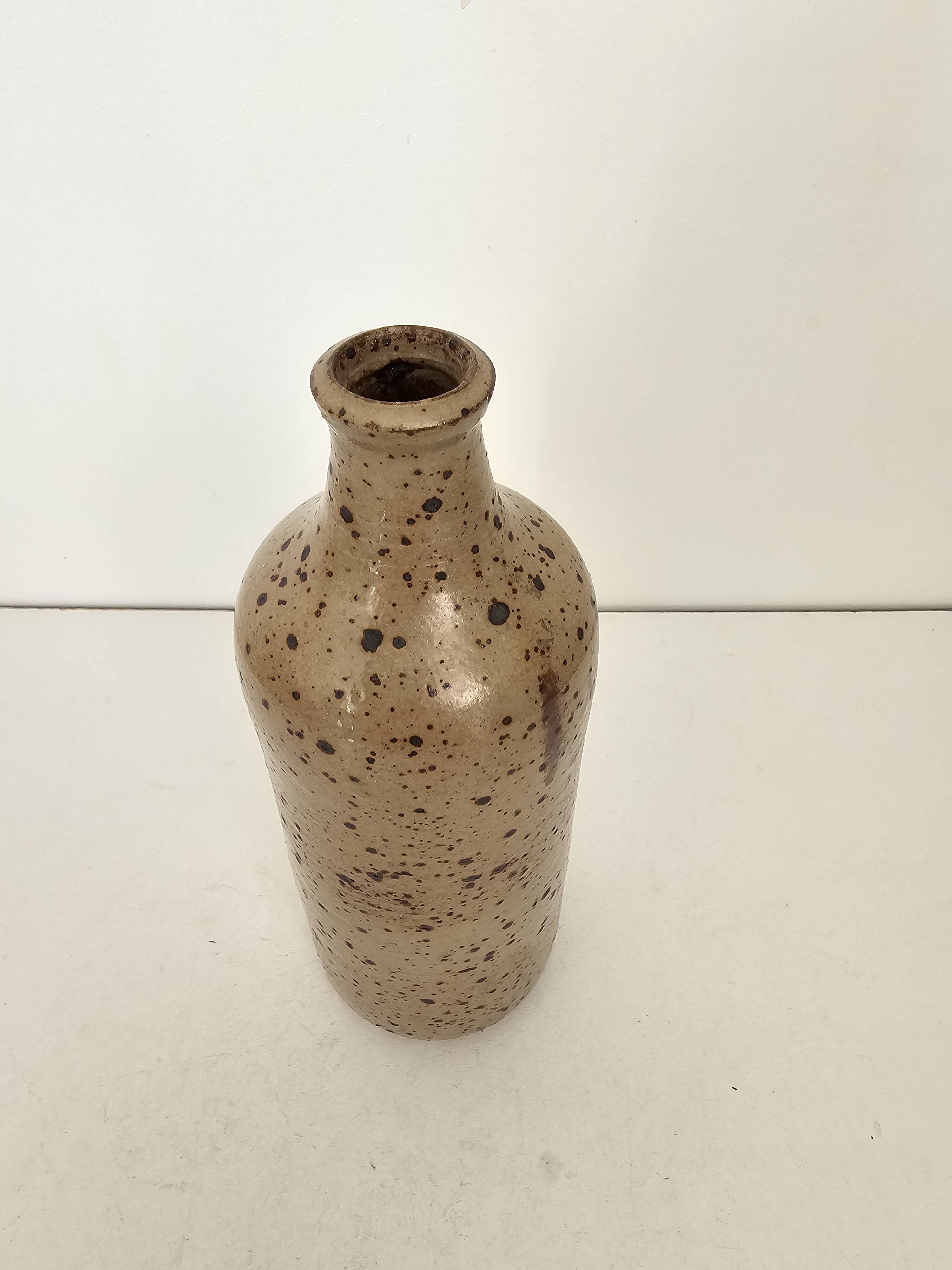 Pyrite stoneware single-flower vase in the shape of a bottle signed Aular?