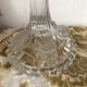 Pair of moulded glass candlesticks, ram heads and masks