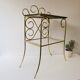 Bedside table in gold metal and black glass