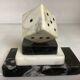 A marble dice bookend
