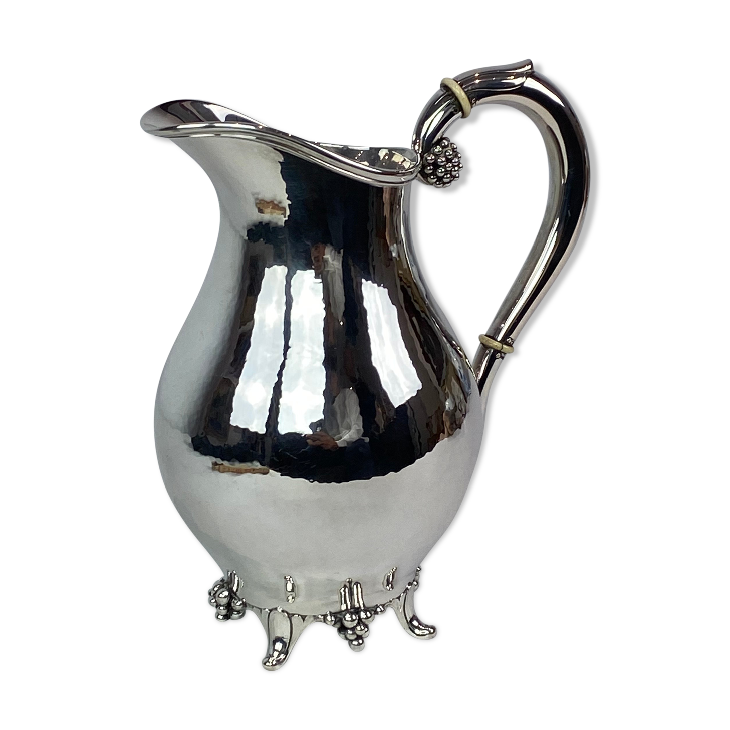 Water jug on feet decorated with ebony of hallmarked silver from the 1940s. The jug is in great anti