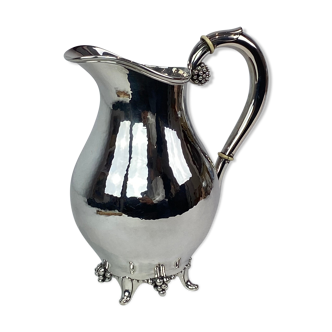 Water jug on feet decorated with ebony of hallmarked silver from the 1940s. The jug is in great anti