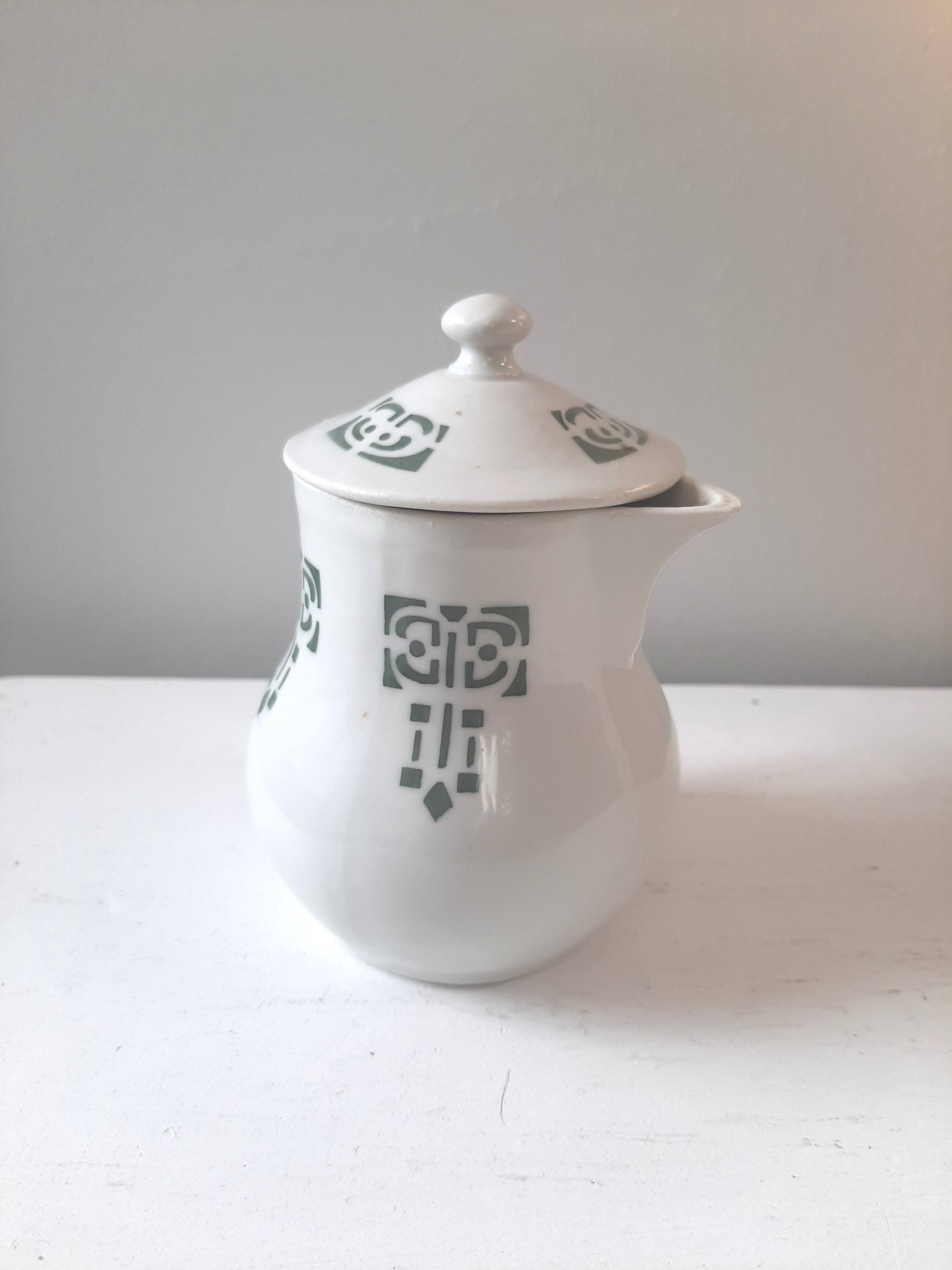 Vintage cream pot with Art Deco pattern and its lid.