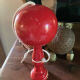 Large red wooden cup-and-ball game, 9 cm in diameter.