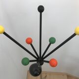 Wearing chrome parrot coat, black and multicolored balls