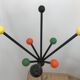 Wearing chrome parrot coat, black and multicolored balls