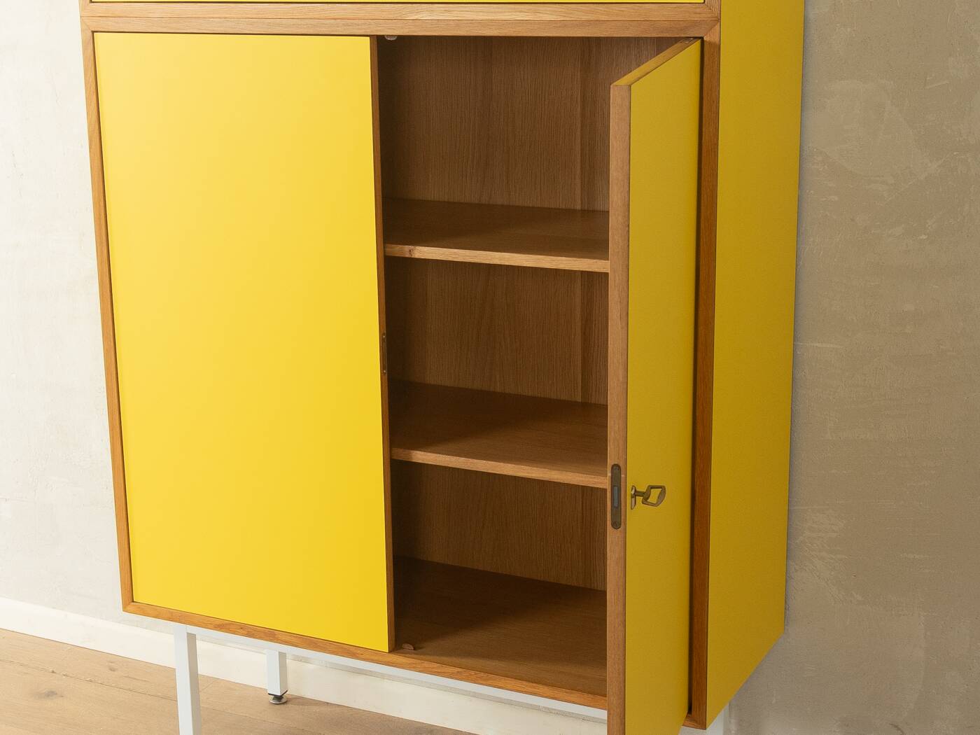 Classic sideboard from the 1960s, oak veneer, yellow Resopal, white steel feet