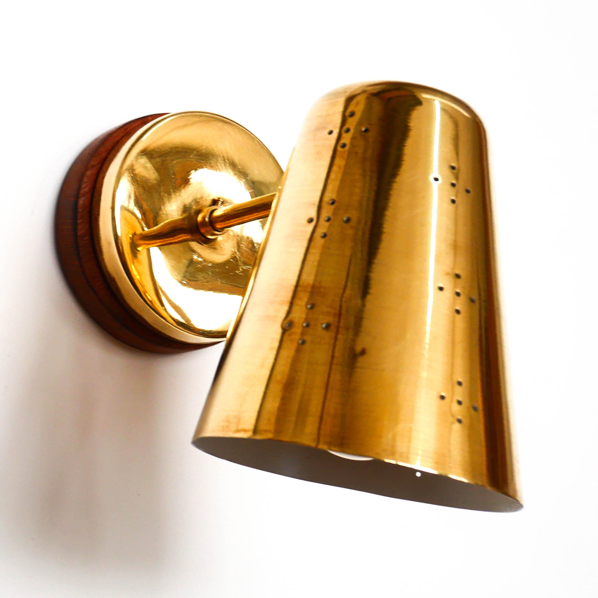 Old conical brass wall lamp, perforated lampshade