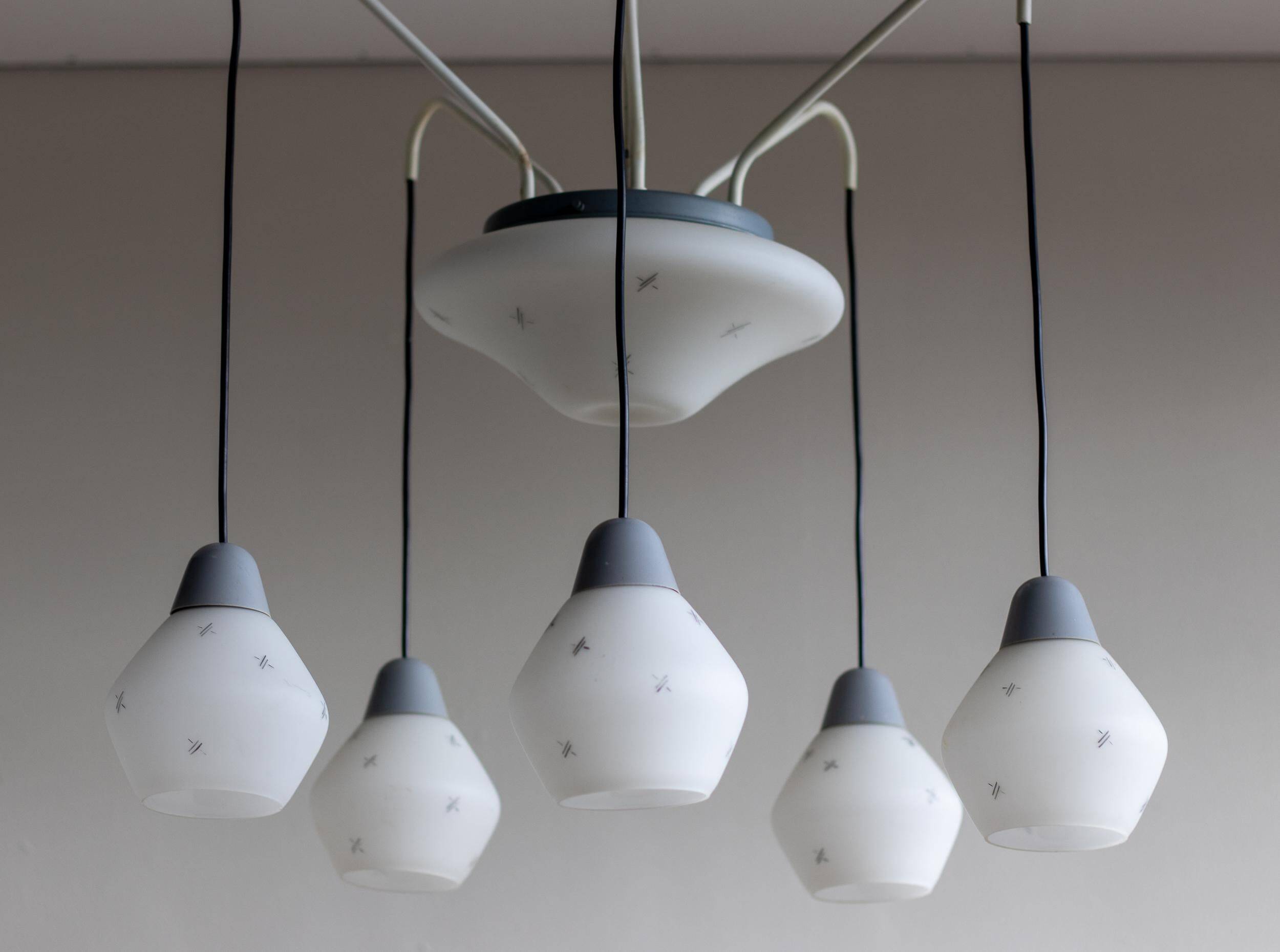 Italian brass enamelled grey chandelier with frosted glass pendants, circa 1960.