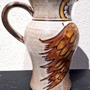 Stoneware water jug, owl decoration, signature to be identified.