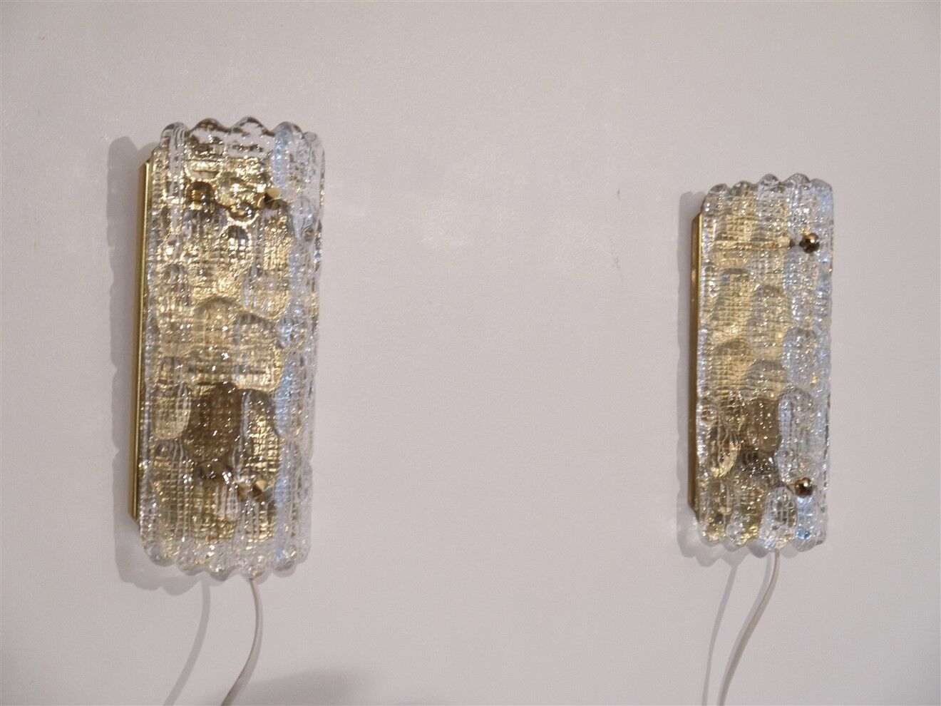 Pair of crystal and brass wall lamps by Carl Fagerlund for Orrefors