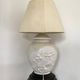 1980s ceramic table lamp with a wooden base and adjustable shade.
