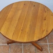 Scandinavian coffee table in solid pine with tripod legs in Swedish chalet style.