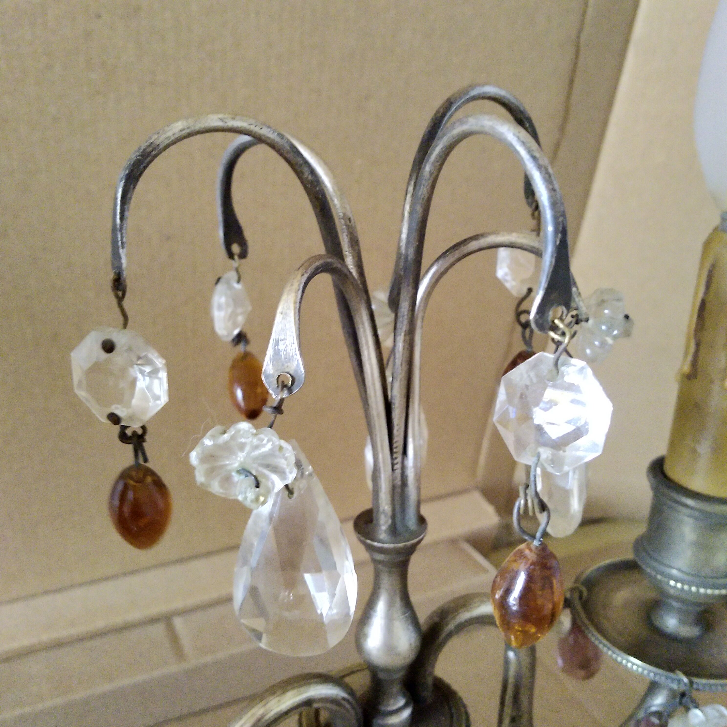 Pair of girandole lamps and silver metal