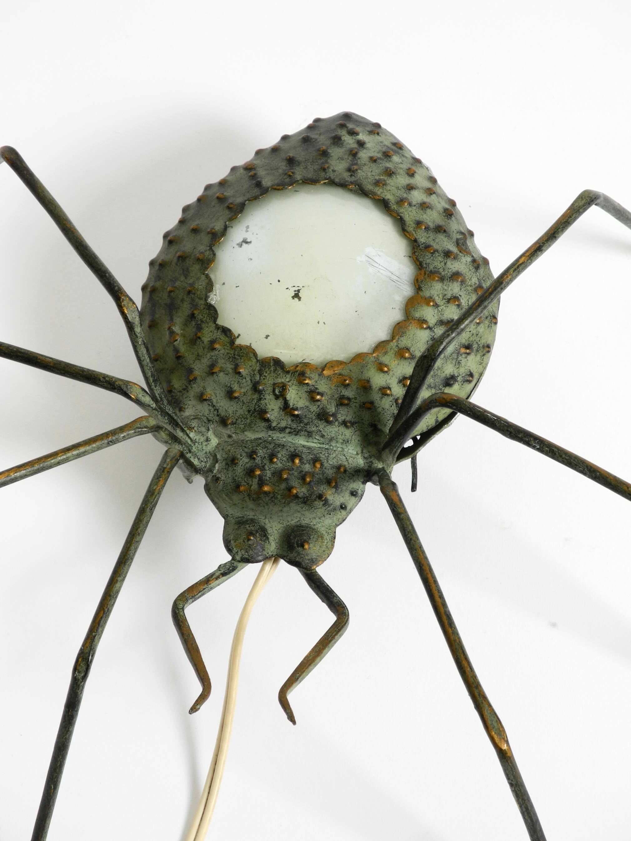 Beautiful Italian Mid Century Modern "Spider" wall lamp made of metal