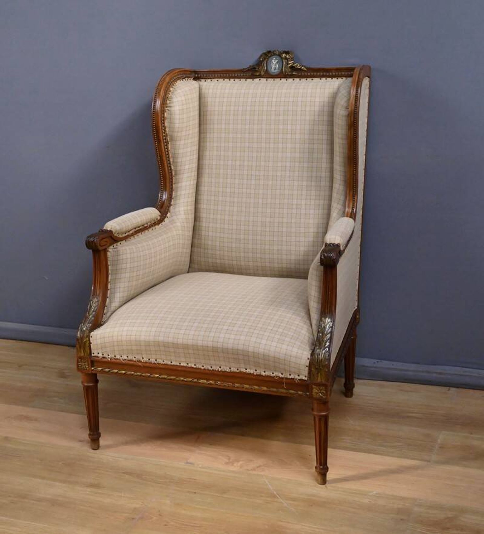 Wingback armchair in walnut, Louis XVI style – late 19th century